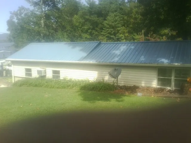 Blue metal roof running the length of a single story home in Kiamesha Lake